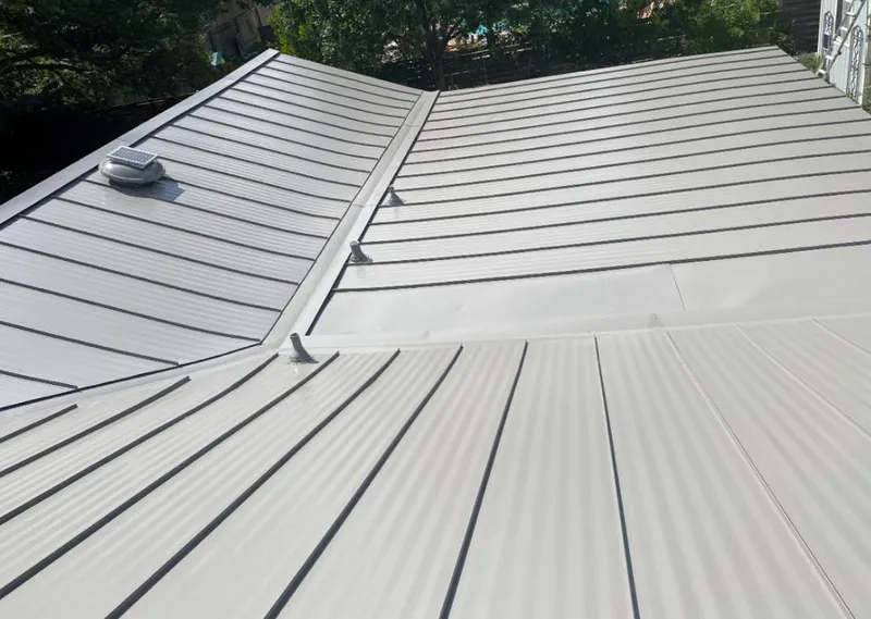Solar attic fan installed on a metal roof for Roof Ventilation in Redondo Beach