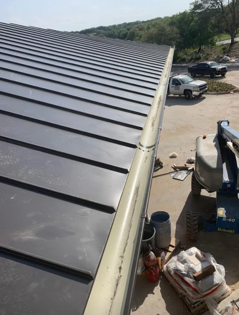 Standing seam panel and gutter detail on a metal roofing jobsite in Redondo Beach